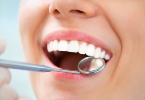 Dentist checking patient's teeth