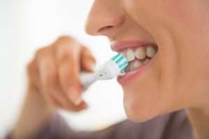 Woman brushing her teeth