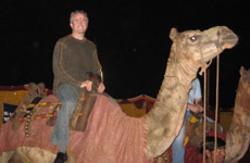 Dr. Arnold rides a camel